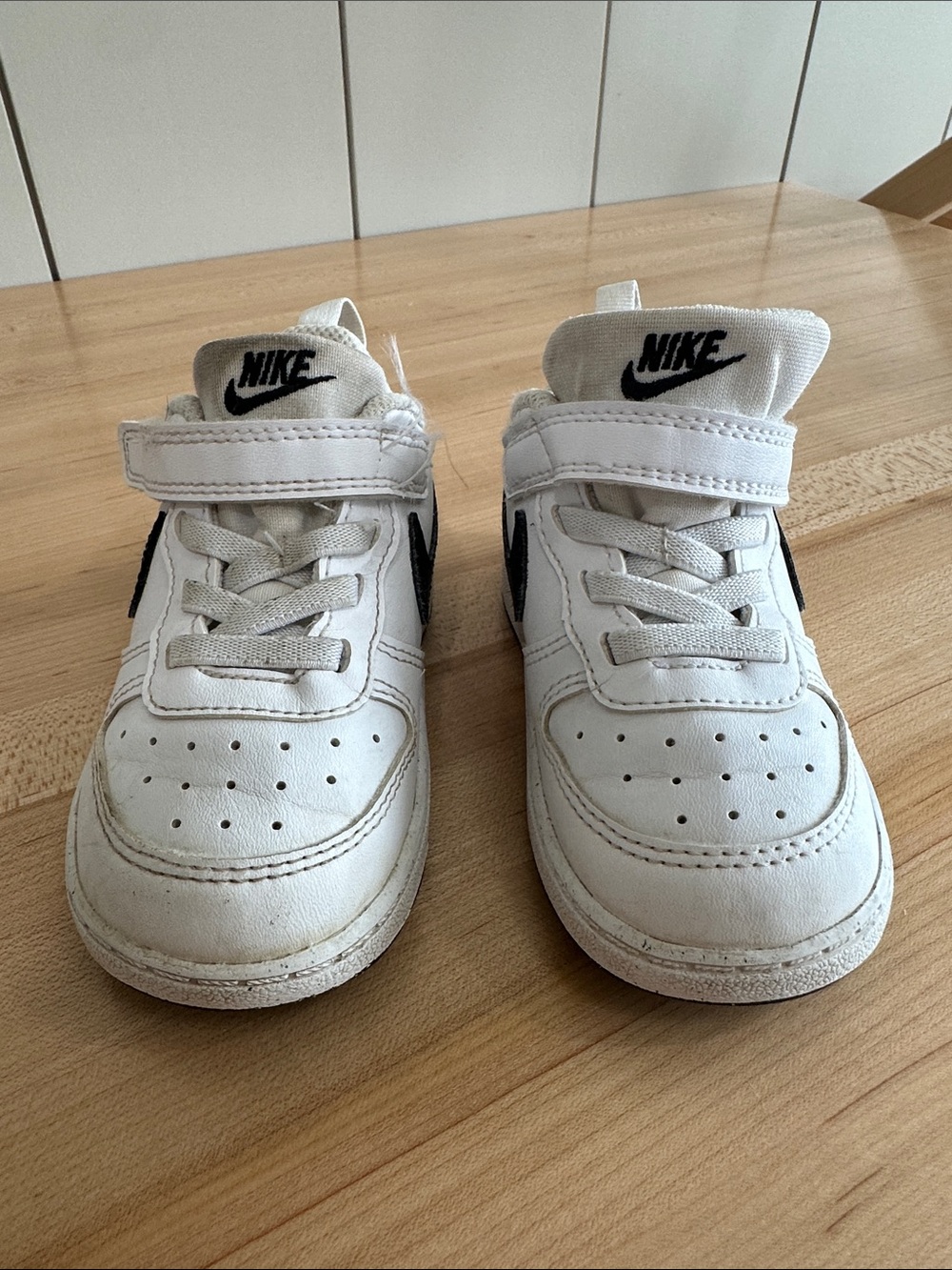 Nike Kids White Sneakers with Black Swoosh
